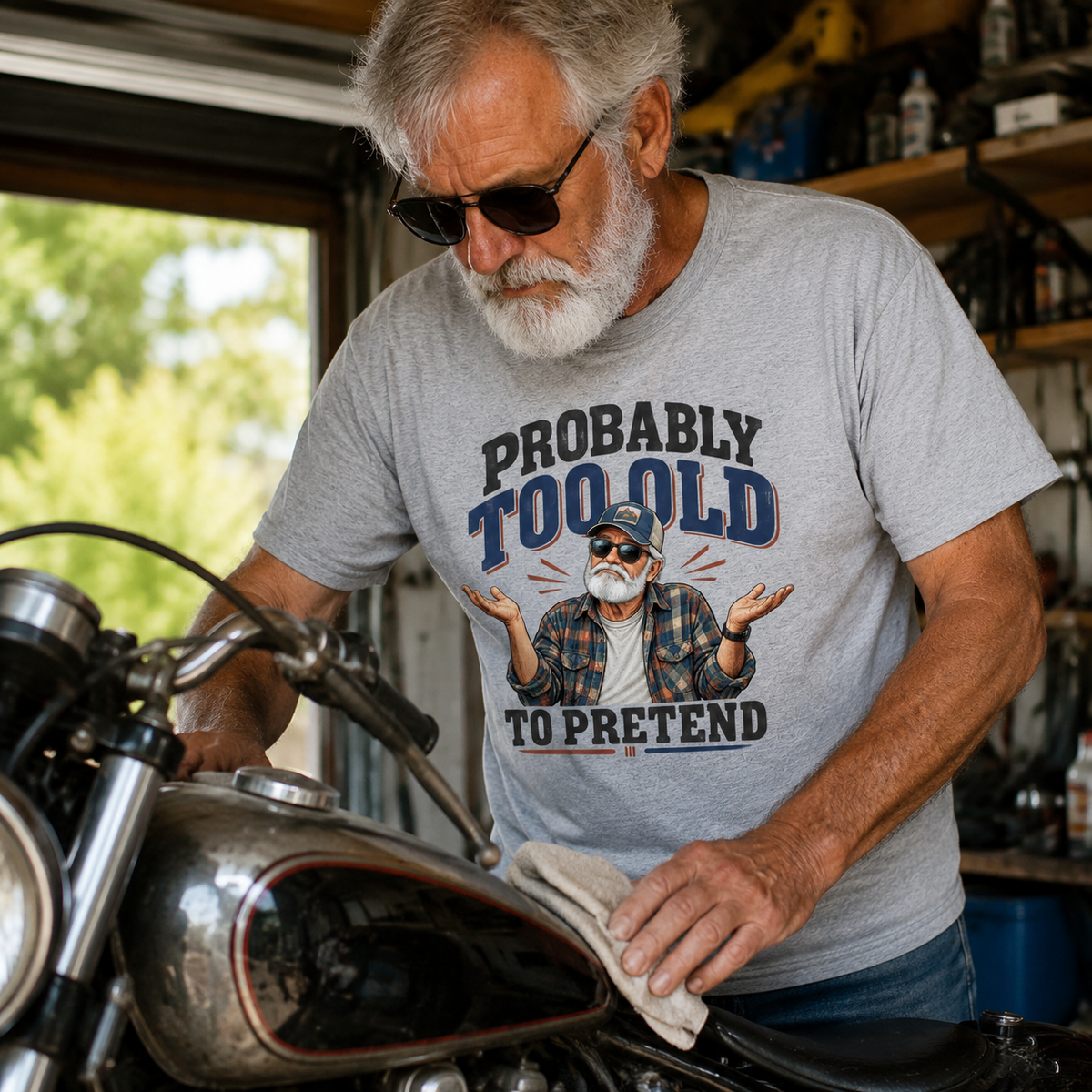 Senior man wearing gray vintage t-shirt with printed Probably Too Old To Pretend design