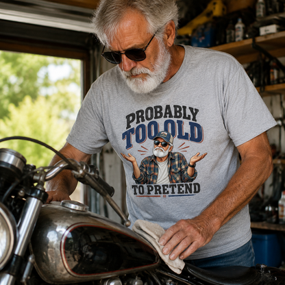 Senior man wearing gray vintage t-shirt with printed Probably Too Old To Pretend design