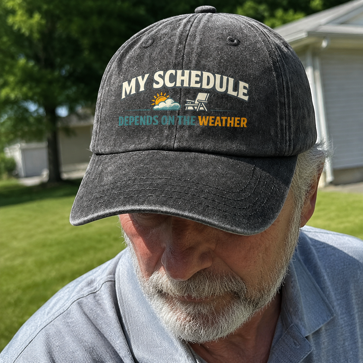 Black vintage washed cap with printed My Schedule Depends On The Weather slogan, senior outdoors