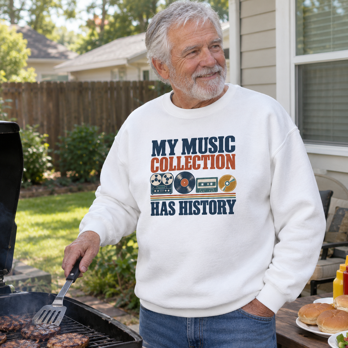 Senior man wearing white vintage sweatshirt with printed music collection slogan while grilling outdoors