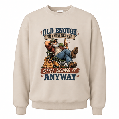 Sand vintage sweatshirt with Old Enough To Know Better Still Doing It Anyway printed front design