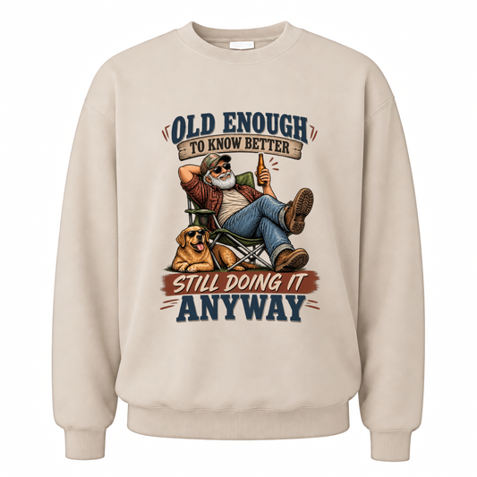 Sand vintage sweatshirt with Old Enough To Know Better Still Doing It Anyway printed front design