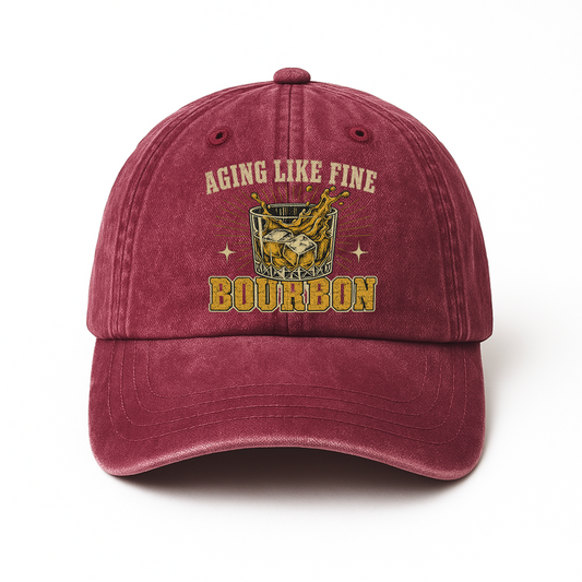 Burgundy washed cap with Aging Like Fine Bourbon whiskey glass printed front design