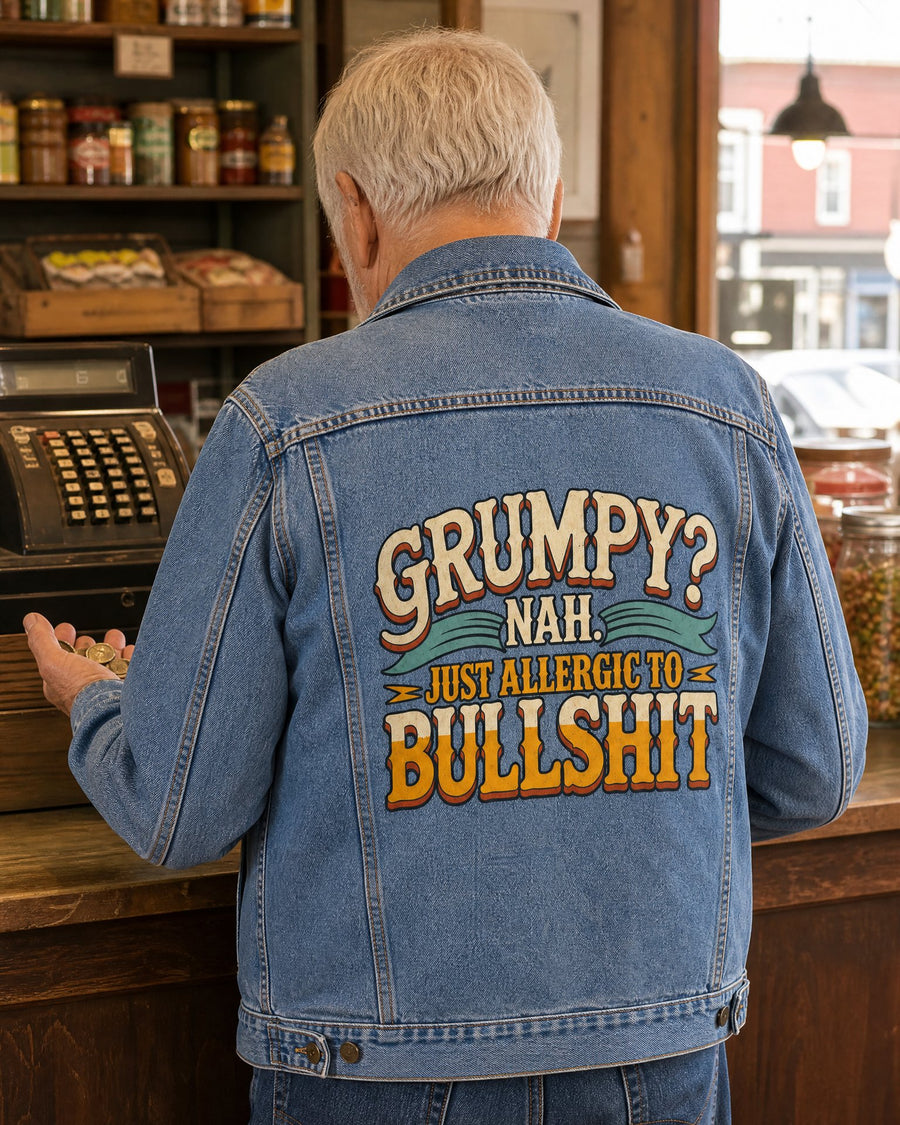 Man seen from behind in the denim jacket counting change at a corner store counter, the design printed large across the back