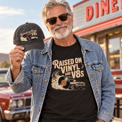 Senior man outside a diner in Raised on Vinyl and V8s denim jacket and t-shirt holding the matching cap