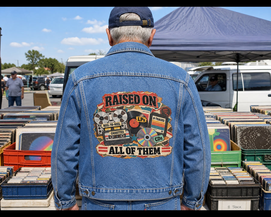 Man in the denim jacket at a flea market record stall, the design on his back